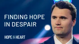A man in a suit looks thoughtfully to the side with blurred stage lights behind him. Text on the image reads: ‘Finding Hope in Despair.’ The Hope for the Heart logo appears in the lower left corner.