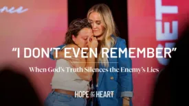 A tearful young woman is comforted by another woman who has her arm around her on stage. Text over the image reads: ‘I Don’t Even Remember’ and ‘When God’s Truth Silences the Enemy’s Lies.’ The Hope for the Heart logo appears at the bottom.