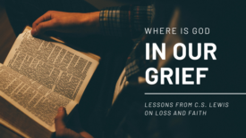 person reads an open Bible in warm, low lighting, with hands holding the pages. Text on the image reads: ‘Where Is God in Our Grief’ and ‘Lessons from C.S. Lewis on Loss and Faith.’