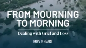 An aerial view of severe flooding shows trees and buildings surrounded by high water. Text on the image reads: ‘From Mourning to Morning’ and ‘Dealing with Grief and Loss.’ The Hope for the Heart logo appears at the bottom.